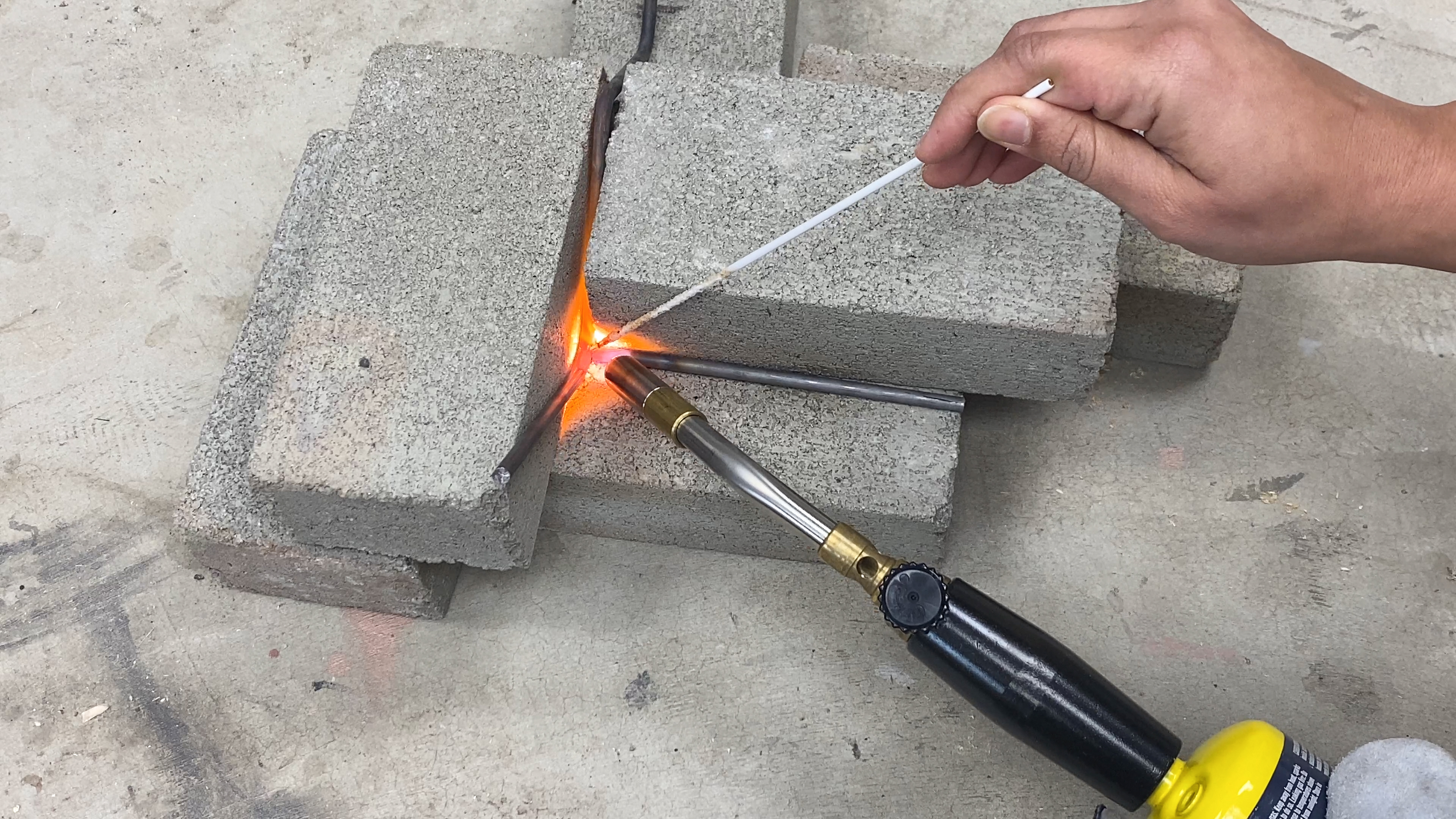 Blow torch for melting metal store