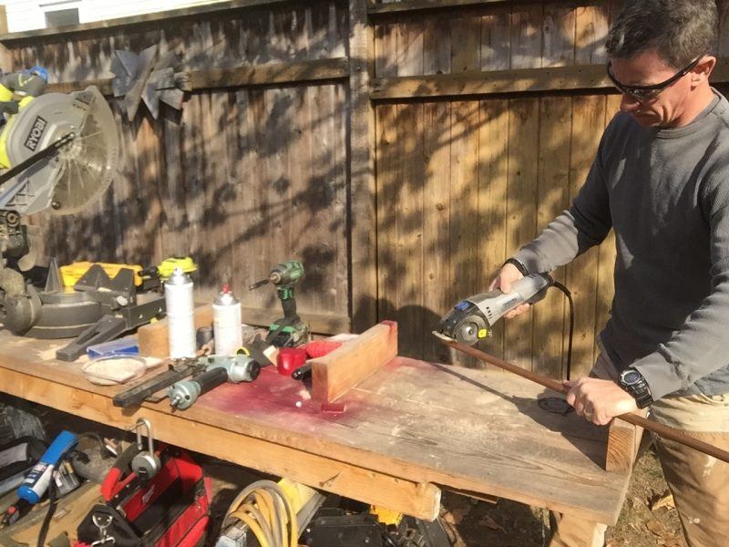 A mini-grinder made cutting the pipe and plywood easy.