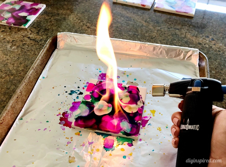 Use Bernzomatic torch to light alcohol paint on tile